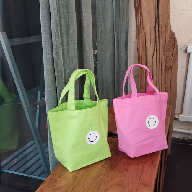 紫色手提包 自创韩版新款手提帆布包女小糖果时尚紫色笑脸果绿手拎包便当包_推荐淘宝好看的紫色手提包