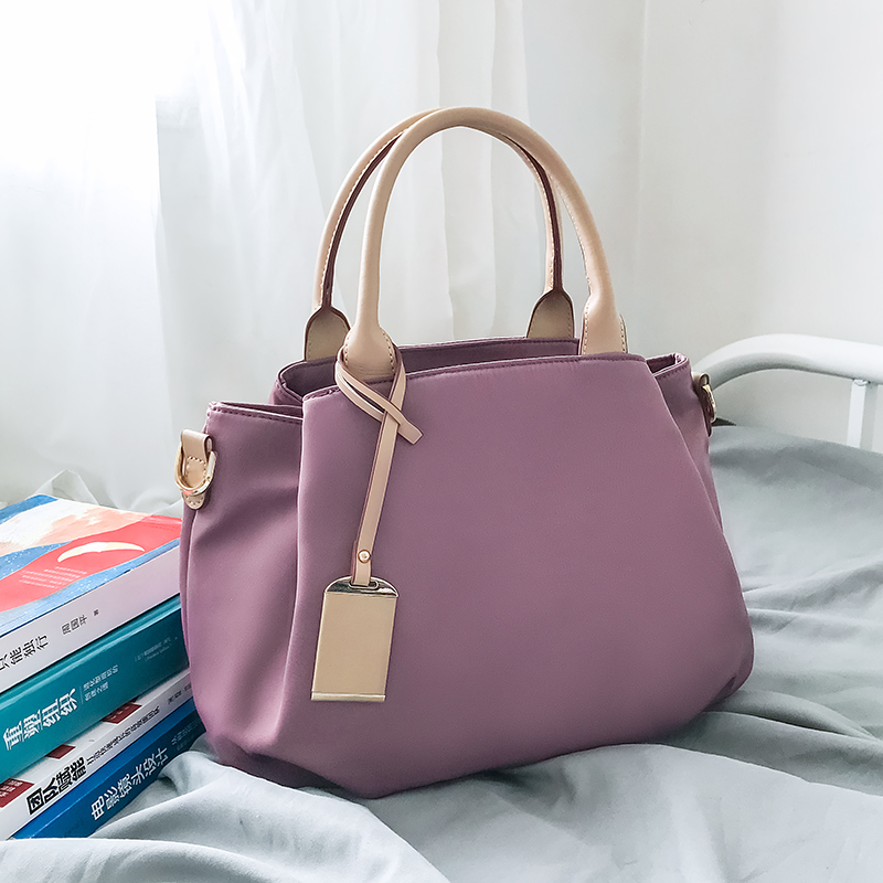 紫色帆布包 妈妈手提包女小众2021新款夏大容量紫色多隔层尼龙帆布包包斜挎包_推荐淘宝好看的紫色帆布包