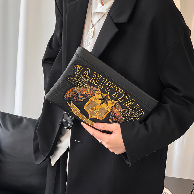 Hong Kong personality embroidery pattern of the new mens hand bag large-capacity leather hand grab bag youth handbag tide