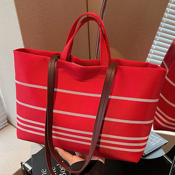 Large capacity canvas bag for women 2025 new fashion versatile ins striped handbag casual commuting tote bag
Large capacity canvas bag for women 2025 new fashion versatile ins striped handbag casual commuting tote bag