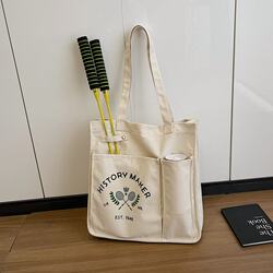 Badminton bag, tennis bag, sports and fitness large-capacity canvas bag, single shoulder women's new high-value portable handheld racket Badminton bag, tennis bag, sports and fitness large-capacity canvas bag, single shoulder women's new high-value portable handheld racket