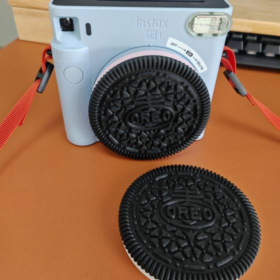 Fuji Polaroid instaxSQ1 digital camera accessories dustproof personality Oreo lens cover protection cover
Fuji Polaroid instaxSQ1 digital camera accessories dustproof personality Oreo lens cover protection cover