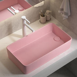 The Left and Right Side Sinks Are Positioned Lower Than the Water Level, with a Fresh Pink Ceramic Countertop Basin Next to the Washing Machine The Left and Right Side Sinks Are Positioned Lower Than the Water Level, with a Fresh Pink Ceramic Countertop Basin Next to the Washing Machine