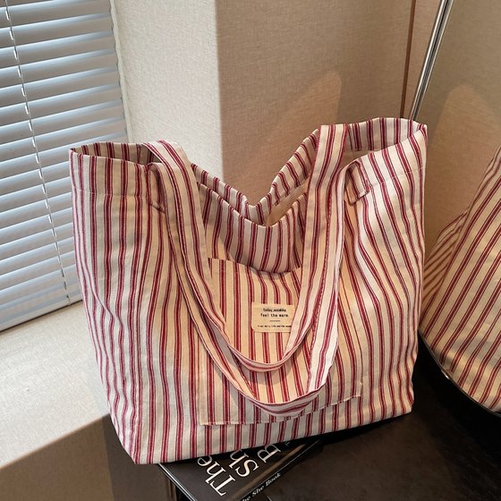 Lazy style striped canvas bag for women large capacity student travel tote bag versatile one-shoulder commuting tote bag
Lazy style striped canvas bag for women large capacity student travel tote bag versatile one-shoulder commuting tote bag