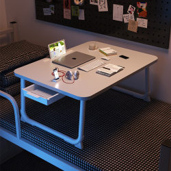 Foldable computer desk for students on bed Foldable computer desk for students on bed