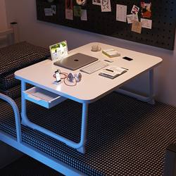 Folding small table on the bed on the bed laptop on the desk laying small table board home office study desk Folding small table on the bed on the bed laptop on the desk laying small table board home office study desk