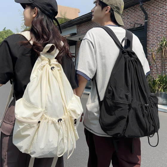 Blogger same style drawstring pocket backpack large capacity commuting backpack men's schoolbag female student light travel bag 
Blogger same style drawstring pocket backpack large capacity commuting backpack men's schoolbag female student light travel bag