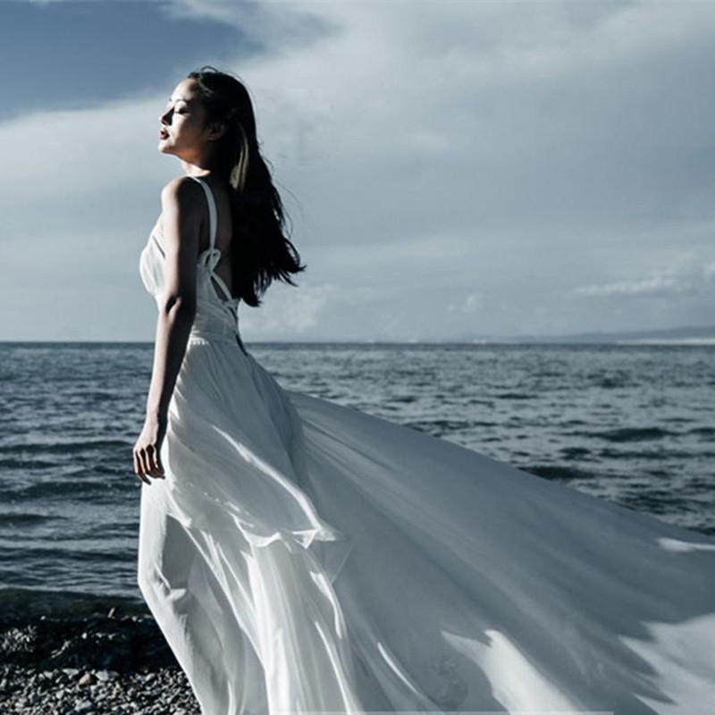 波西米亚吊带不规则大摆女神长裙露背性感修身沙滩海边度假连衣裙