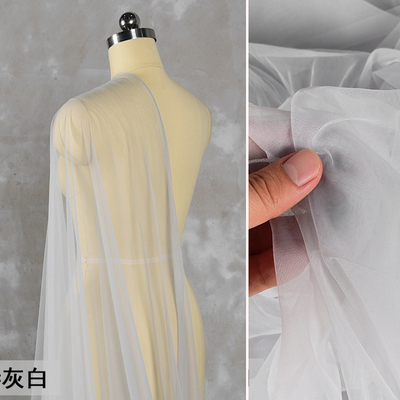 taobao agent Light gray and white ultra -transparent mesh encrypted Swiss web fabric dress wedding gauze seeing veil designer fabric