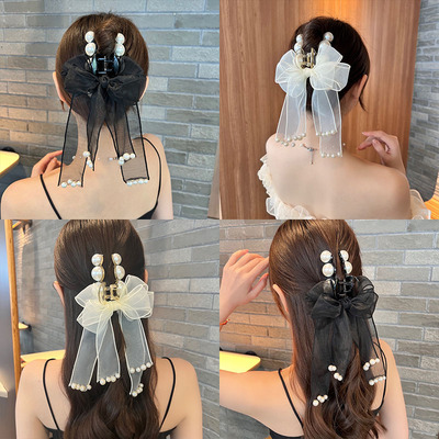 taobao agent Bow head jewelry grabbing the back of the head, the girl summer net yarn ribbon pearl hair clip large shark clip high -level sense