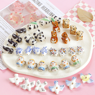 taobao agent Cute and funny hand -painted ceramic pigeon angel panda fish animal bead DIY handmade beaded material