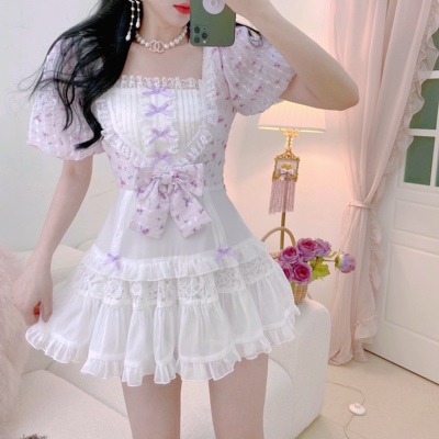 taobao agent Accompanying the romantic dress of the summer flower, the gentleness is gentle, the unique fairy bow pink purple color skirt