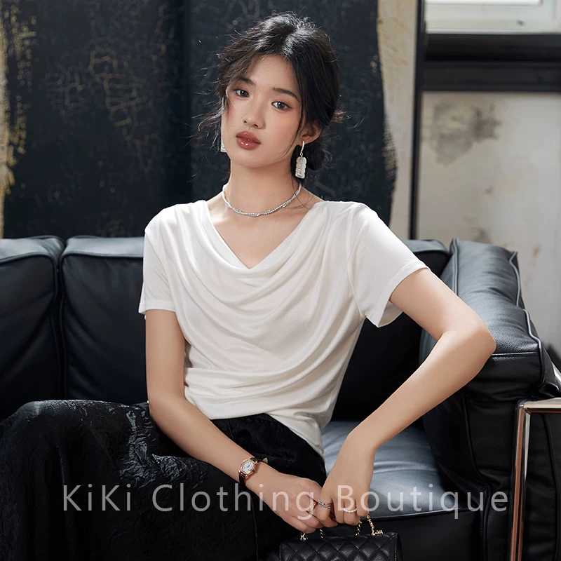 Домашняя silky наслаждение Kiki? и звучит awkward. But translate: "Kiki homemade silky enjoyment_Spring and summer white short-sleeved T-shirt acetic collar one-length elegant top for women"