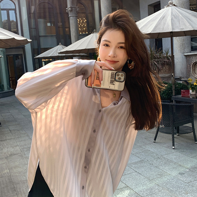 taobao agent Xia Shiwen thin semi -transparent shirt loose, simple striped, wild white top female summer 2022 new small shirt