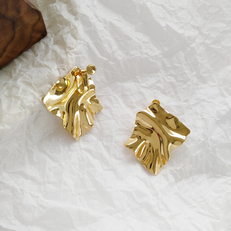 A pair of geometric ear clips