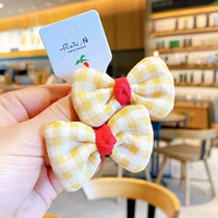 Желтая заколка для волос с бантиком