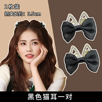 Пара черных зажимов для царапин на кошачьих ушках.