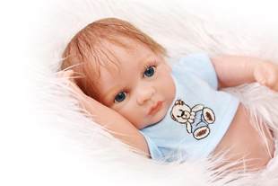 Small cute realistic doll for boys, toy