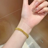 Золотой эластичный браслет с одной бусиной