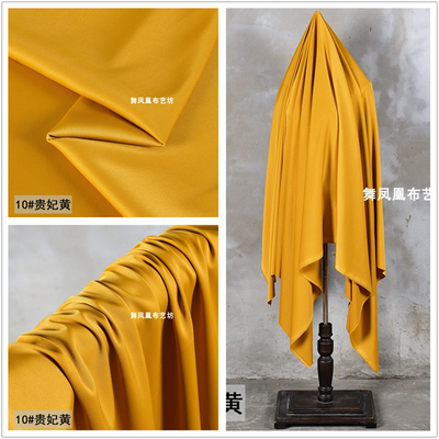 taobao agent Amber yellow heavy diamond bright silk imitation acetate satin fabric pendant filament pants shirt shirt small suit fabric