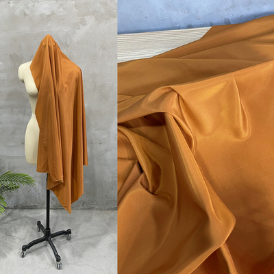 taobao agent Caramel light brown glossy silk cotton fabric, glossy spring and summer shirt Hanfu, non-elastic, light and opaque fabric