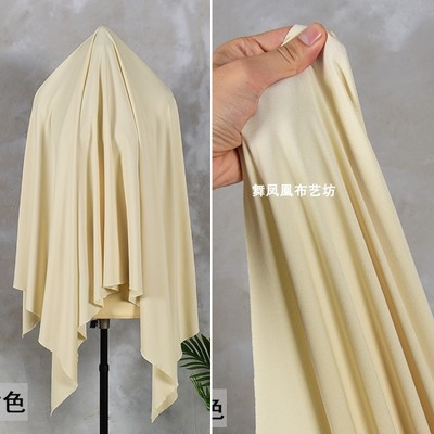 taobao agent Smooth beige straight tribute woven four -sided elastic fabric thin vertical bottom shirt skirt skirt clothing fabric