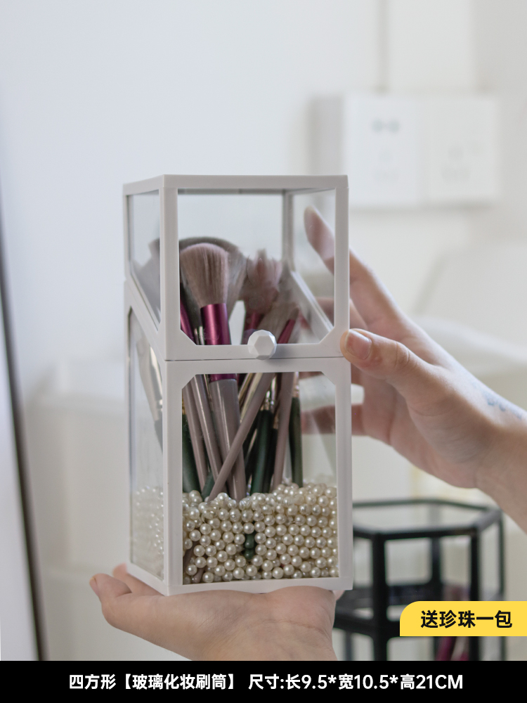 Square glass brush bucket with white edges and a pack of pearls