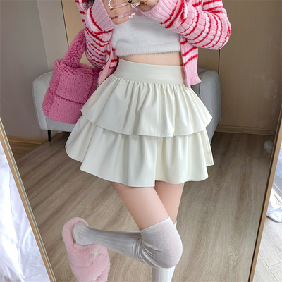 taobao agent Nuo の autumn and winter high -waisted hot girl short skirt showed long reflection leather cake skirt American niche skirt