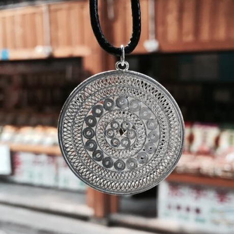 凤凰古城银号s999纯银 民族手工拉丝镂空吉祥太阳鼓 掐丝苗族银饰