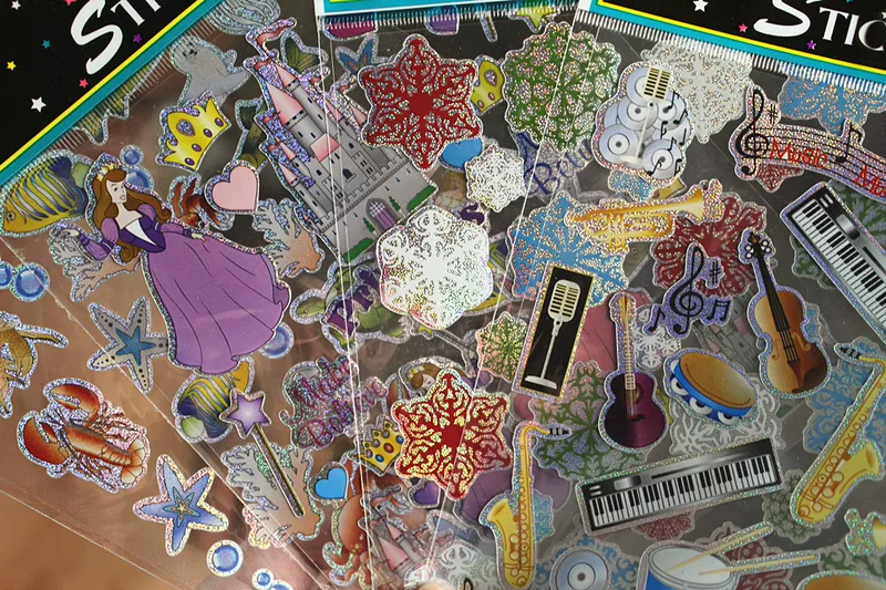 ("Cross-border trading"), space musical instruments, racing car, train, sticker, with snowflakes