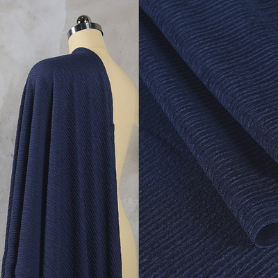 taobao agent Blue, black and navy blue tripe cloth pleated cloth texture fabric, elastic, smooth and soft, spring and summer shirt trousers fabric