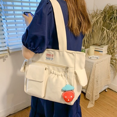 taobao agent Japanese one-shoulder bag, handheld strawberry, pendant, 2022 collection, Korean style, simple and elegant design