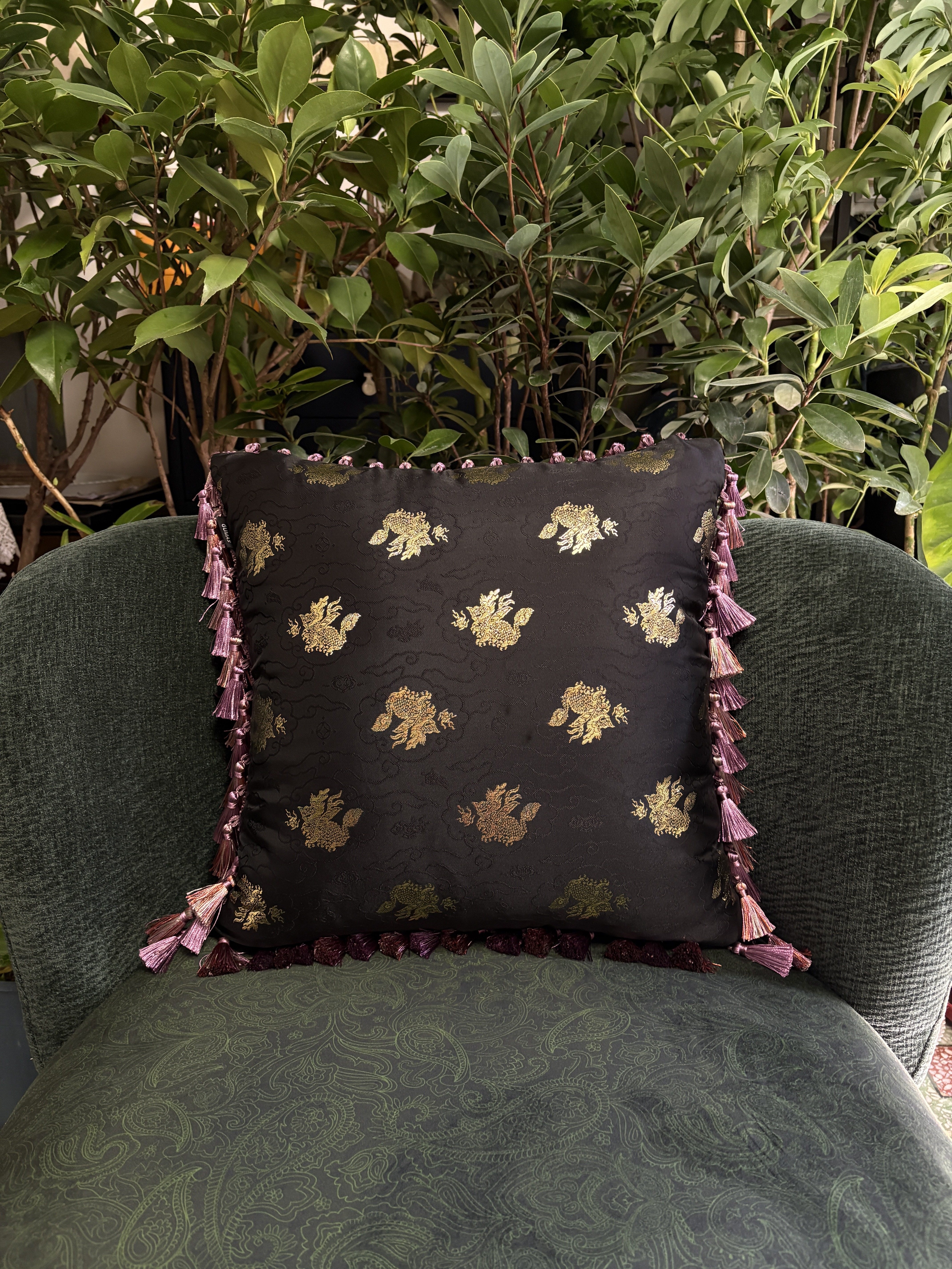 Chinese peony and crane embroidered black velvet cushion cover with white piping trim and mauve tassel detail