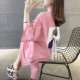 Áo thun ngắn tay của phụ nữ váy mùa hè 2021 mới đáy rộng thiếu quần áo phụ nữ dài giữa Xuanya phong cách màu hồng trên cùng - Áo phông