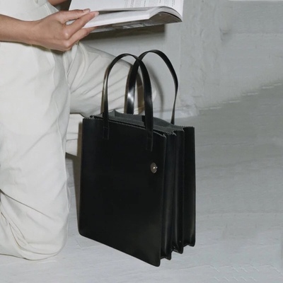 taobao agent Designer model minimalist multi -layer handbags mostly use Korean retro school shoulder document large -capacity package