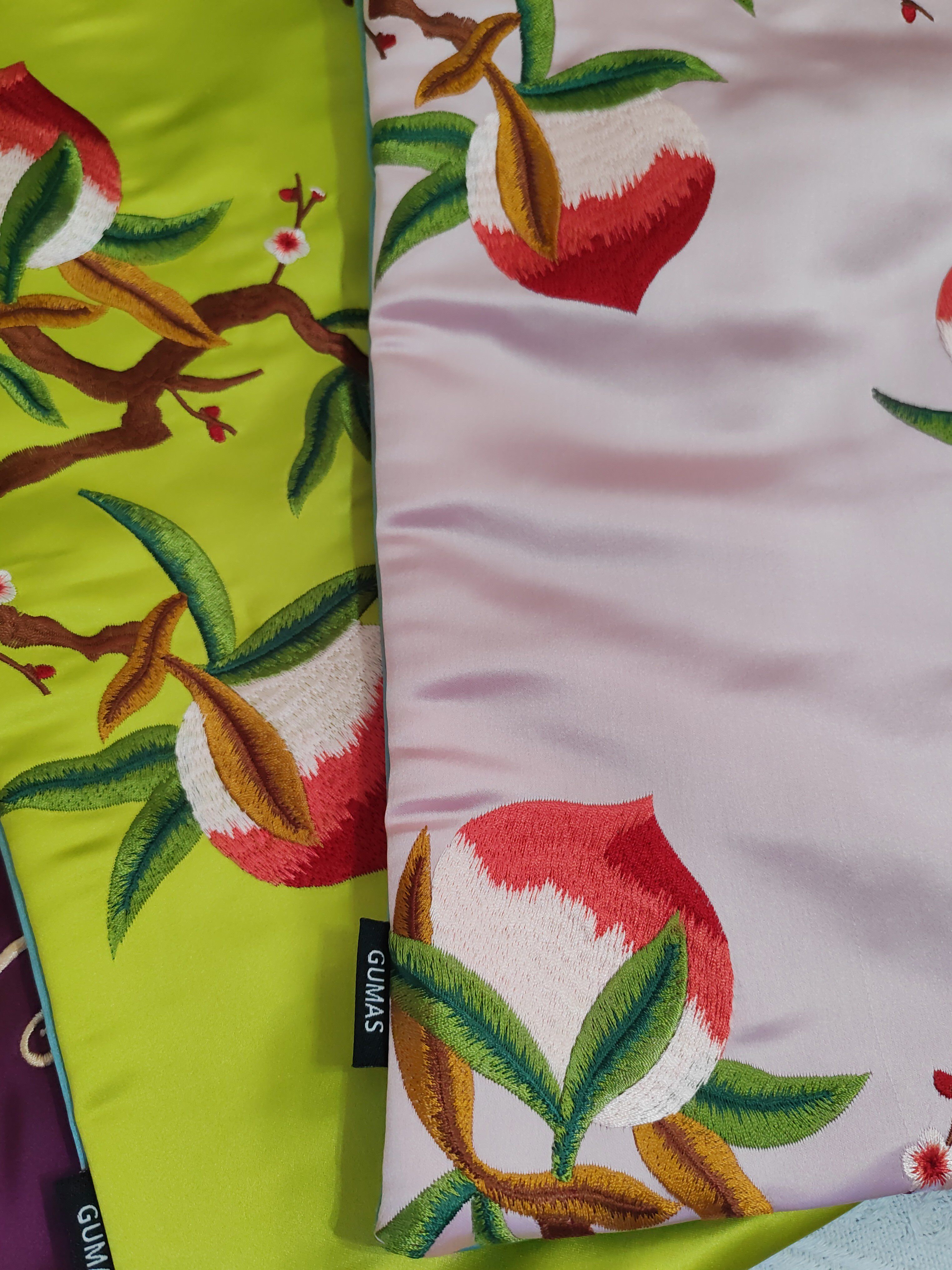 Pink and green silk embroidered pouches with optional tassel trim detail