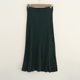 Spring and Autumn Pit knitted half skirt solid color button decoration simple temperament medium long A -line skirt outer single -tail cargo women's clothing