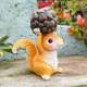 Little squirrel lifts pine cones and decorative ornaments cute animals home desktop decoration balcony outdoor gardening landscaping arrangement