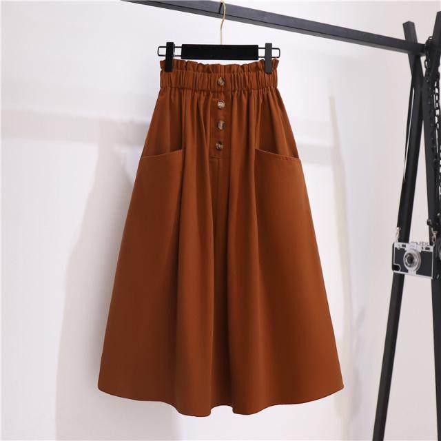 Spring and summer new high -waisted thin waist pine tight waist button decorative pocket design medium long A -line skirt