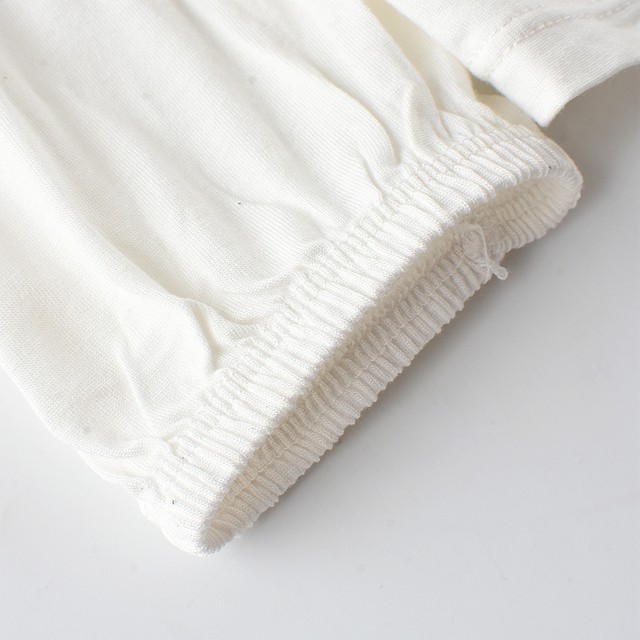 R2 European and American Foreign Trade Captain's Autumn Loose Knit Soft Top Soft Top Sleeples Sleeve Sleeve White White Lace Switch Women's T -shirt