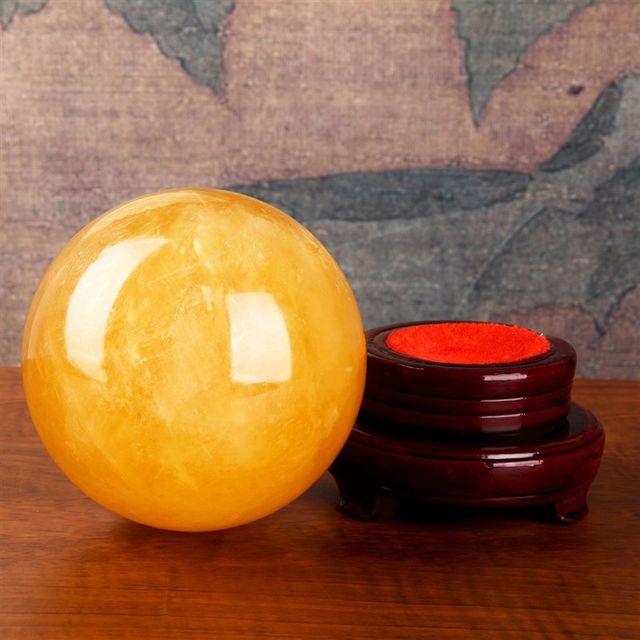 Natural yellow crystal ball ornament real raw stone kitchen office entrance flowing water crystal ball natural raw stone
