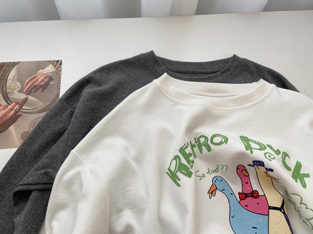Ningbo Home. Cute cartoon duck print thickened grinding round neck long sleeve T-shirt for women 2025 spring loose base shirt