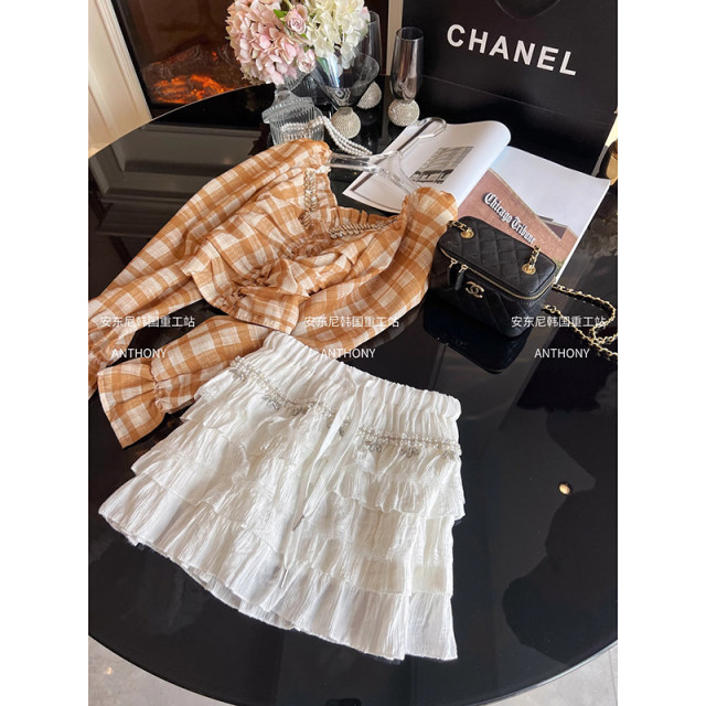 2025 summer super fairy sweet spliced ​​lace shirt skirt women's high waist heavy industry diamond inlaid versatile cake skirt short skirt