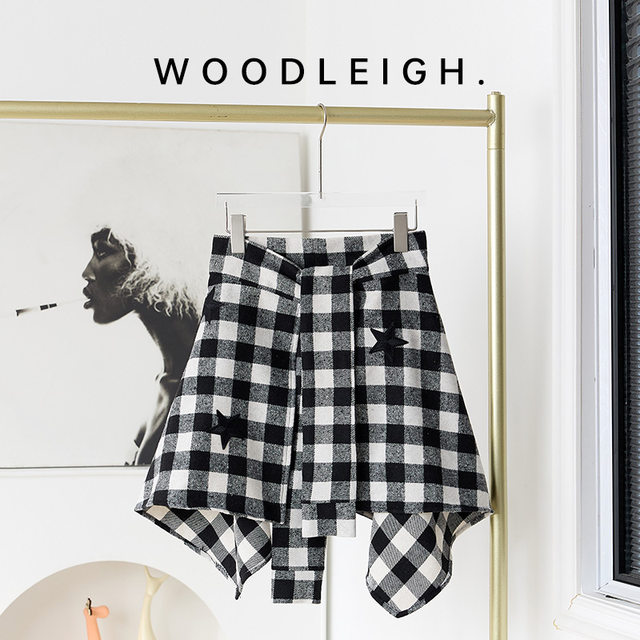 Spring new black and white plaid one-piece lace-up skirt straps covering the cross dance irregular tweed warm skirt