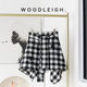 Spring new black and white plaid one-piece lace-up skirt straps covering the cross dance irregular tweed warm skirt