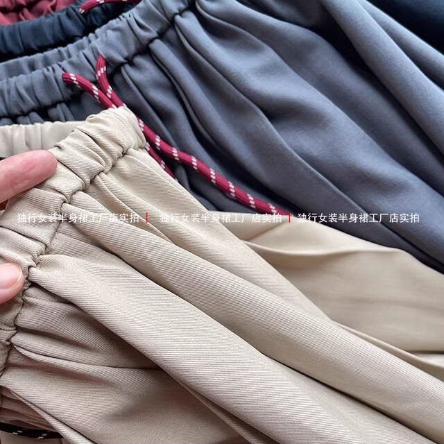 Thirteen Lines Autumn New Korean version solid color Korean version rubber waist pleated skirt mid-length women's skirt lace-up versatile umbrella skirt