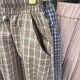 Retro plaid pocket skirt for women in spring and summer new high-waisted ruffle skirt for women lace spliced ​​plaid a-line skirt