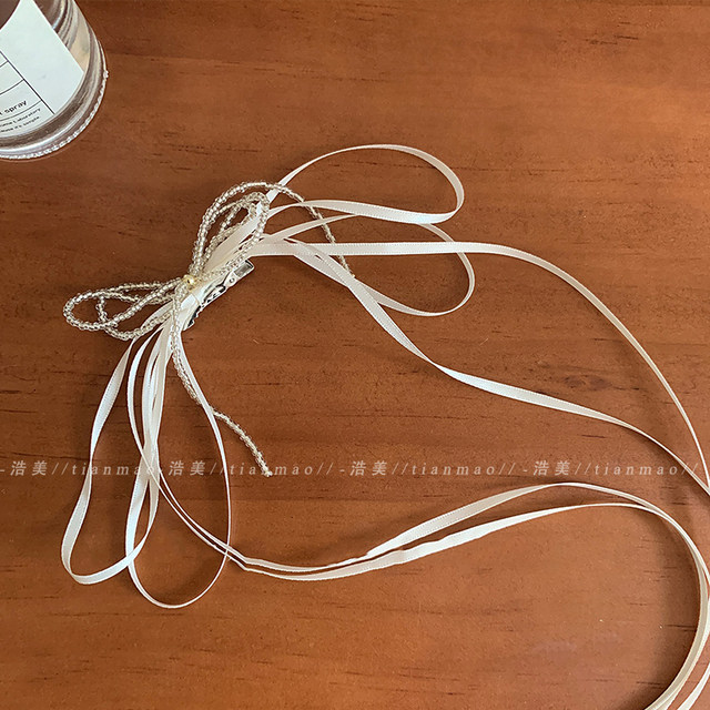 Streamer bow hair clip 2025 new high-end headdress side high-end exquisite clip tassel ribbon hair card
