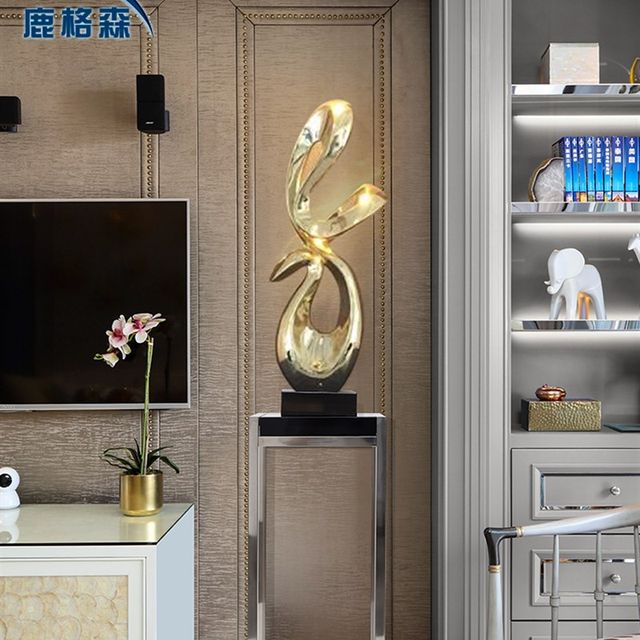 
Large floor-standing ornaments next to the TV cabinet in the living room, light luxury decorative art, model room, soft decoration, sculptures and crafts