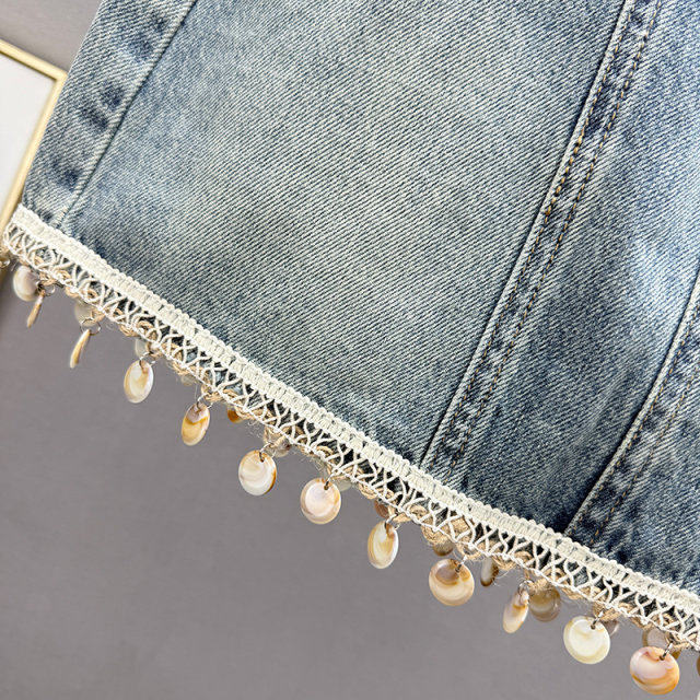 Retro old denim skirt women's short skirt 2025 summer new high-waisted slim tassel A-line hip skirt